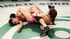 Ebony athlete eats pussy and lowers herself on a strap-on during an erotic wrestling match.