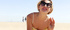 Beautiful blonde teen loves sunbathing on the beach