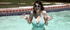 sexy brunette enjoys swimming