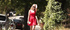 Hot busty blonde in red dress poses while walking outdoors
