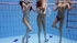 Three tight-bodied girls filmed swimming naked underwater