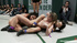 Boobilicious Asian with plait wrestlilng furiously with two other girls on the ring in public
